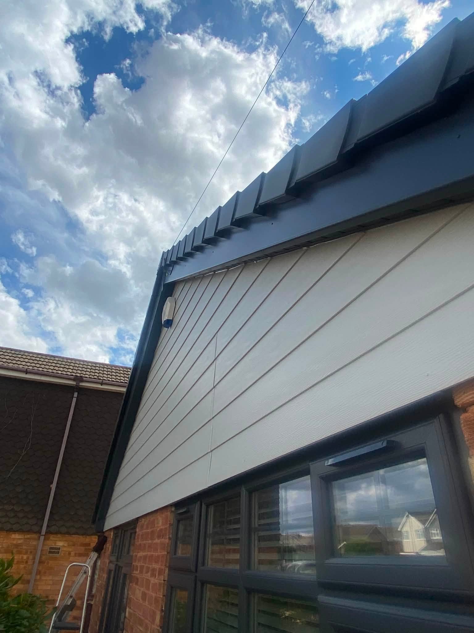 Anthracite grey UPVC cladding installed to gable end wall — LDF Fascia & Guttering, West Midlands