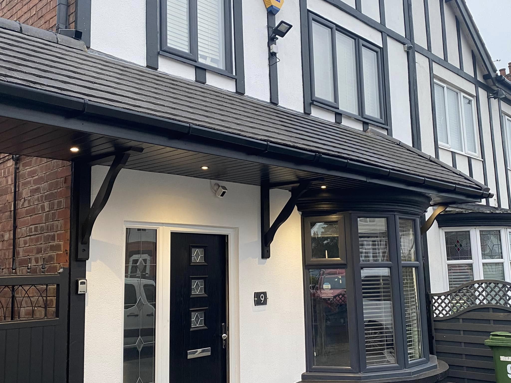 Black fascia, soffit and guttering installed on Tudor-style porch canopy — LDF Fascia & Guttering, West Midlands