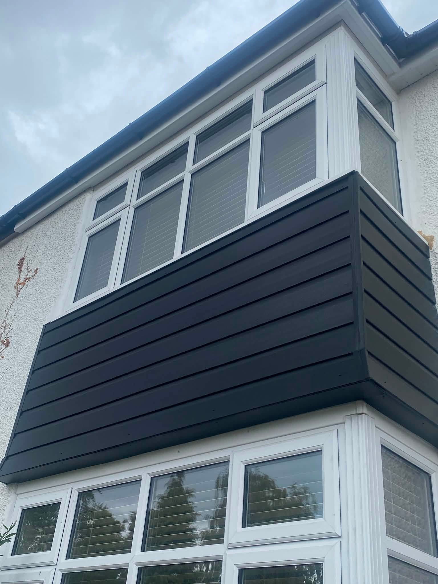Close-up of anthracite grey UPVC cladding fitted to bay window dormer — Wolverhampton cladding specialists